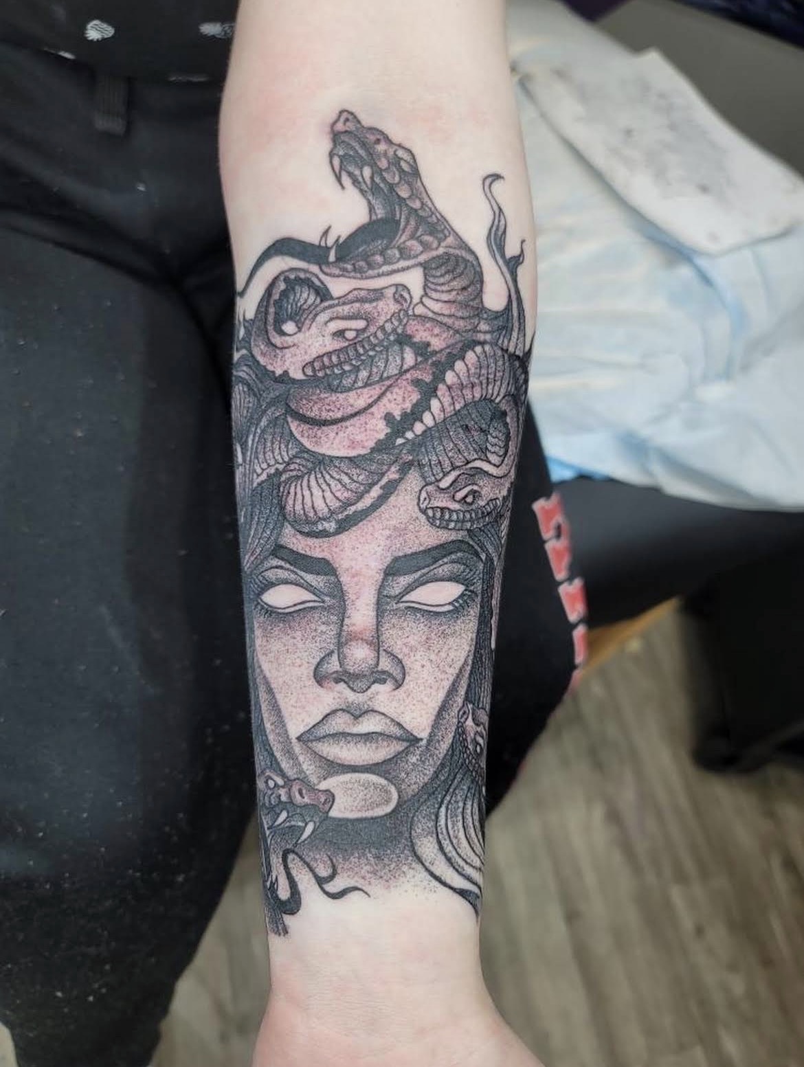 Medusa forearm tattoo with snakes